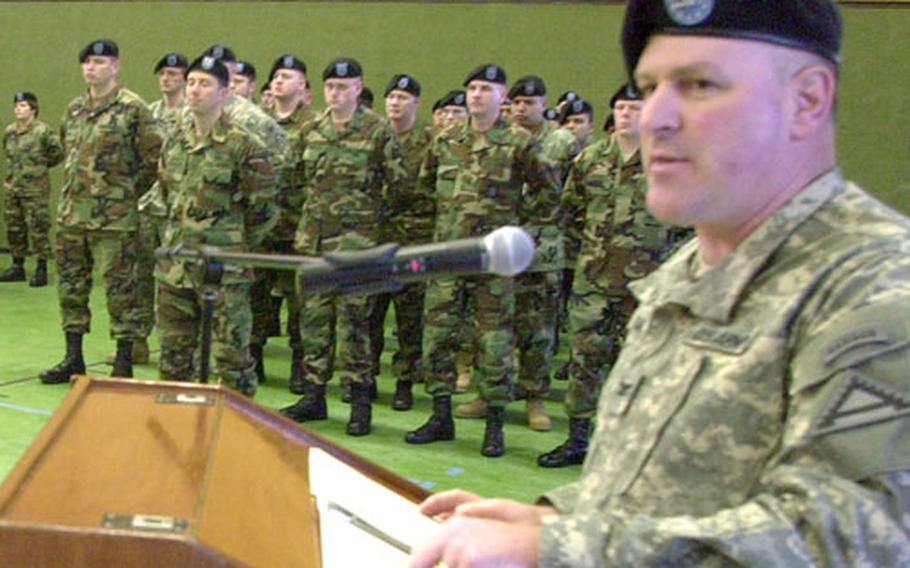 Joint Multinational Training Command chief of staff Col. Michael Clark speaks at an activation ceremony for Headquarters Headquarters Company, JMTC on Monday.