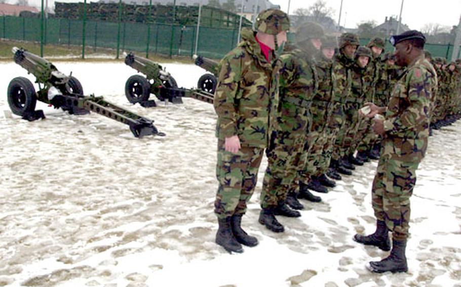 Soldiers from the 1st Infantry Division Division Artillery case their unit’s colors Wednesday at Warner Barracks in Bamberg, Germany.