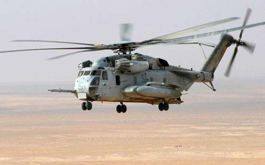 Two U.S. Marine Corps CH-53E helicopters, similar to the one shown, went down Friday carrying a dozen troops.