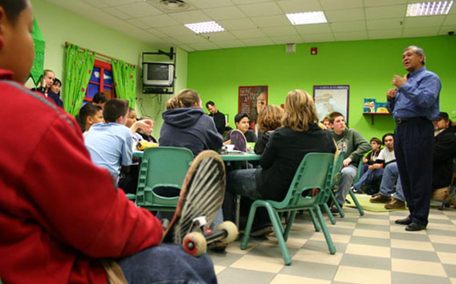 Al Zaldo, the safety director at Naval Support Activity Naples, talks to about 30 teens and children Wednesday about safety regulations regarding the much-anticipated opening of the skate park built at the support site. The park is slated to open March 4.