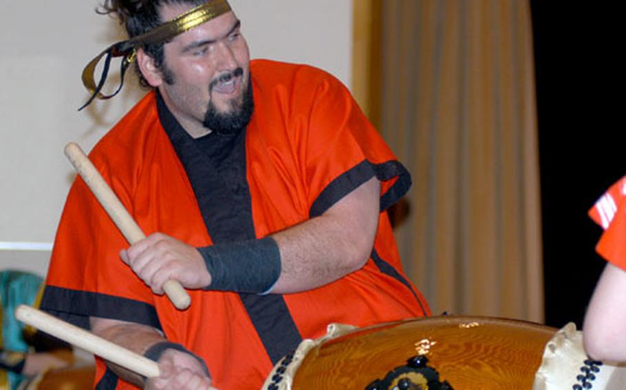 David Wray, a member of the Dragon Eagle taiko drum team at Misawa Air Base, Japan, beats a taiko drum with bachi sticks on Saturday during the group’s concert on base. The American taiko drum group celebrated its seventh anniversary Saturday.