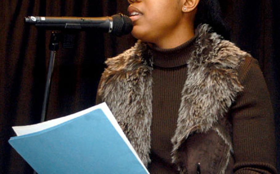 Staff Sgt. Natasha Cottrell, a personnel specialist with the 48th Operations Support Squadron, delivers a love-inspired poem titled "It Ticks" during a poetry showcase at RAF Alconbury last week.