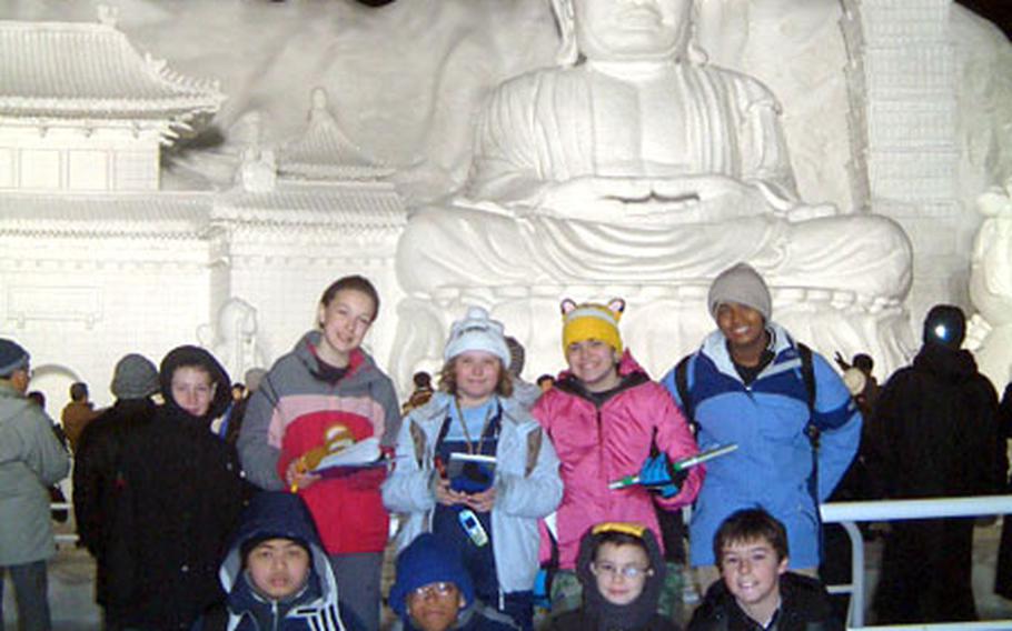 Students from Cummings Elementary School at Misawa Air Base, Japan, stand in front of the “Big Buddha” snow sculpture at the Sapporo Snow Festival earlier this month.