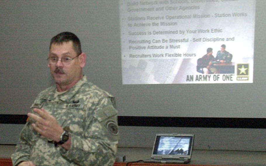 Sgt. 1st Class Neftali Perez talks to soldiers interested in being recruiters at Camp Hovey on Thursday as part of a weeklong trip to bases in South Korea.