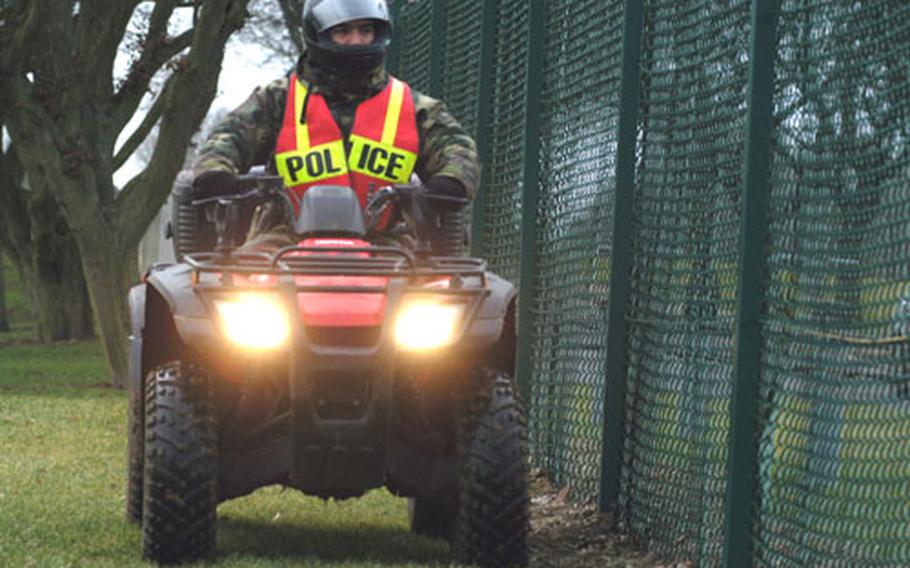 Airman 1st Class Anthony Harmon, an installation patrolman for the 422nd Security Forces Squadron, drives an all-terrain vehicle along the perimeter fence of RAF Croughton. Patrolmen use ATVs to check for suspicious activity in areas that patrol cars can’t get to.