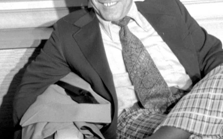 New York Mets manager Yogi Berra relaxes after his team's arrival in Tokyo in October, 1974.