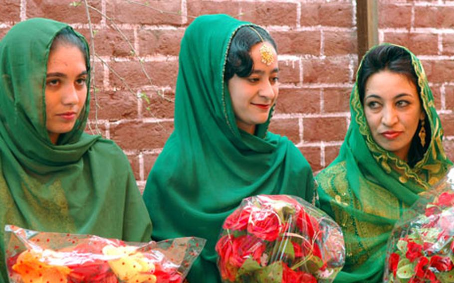 Najmeen Bibi, center, graduated at the top of her class at the first midwifery academy in Khowst province, Afghanistan. Names of the other women in the photo were not available.