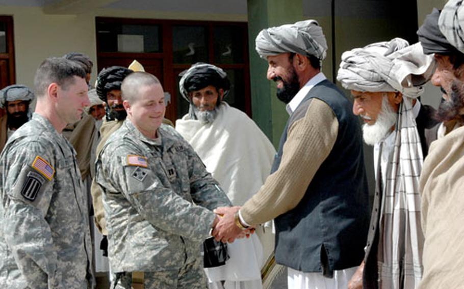 Lt. Col. Joe Fenty, commander of the 3rd Battalion, 71st Cavalry Squadron, left, and B Troop commander Capt. Frank Brooks, speak with Tani district sub-governor Badi Zaman and local elders at the district compound. The battalion will conduct reconnaissance operations with special attention to the Pakistan-Afghanistan border.
