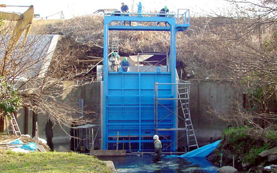 A spill gate at Naval Air Facility Atsugi, Japan, was installed last month to prevent contaminated water from reaching Japanese land should a spill occur.
