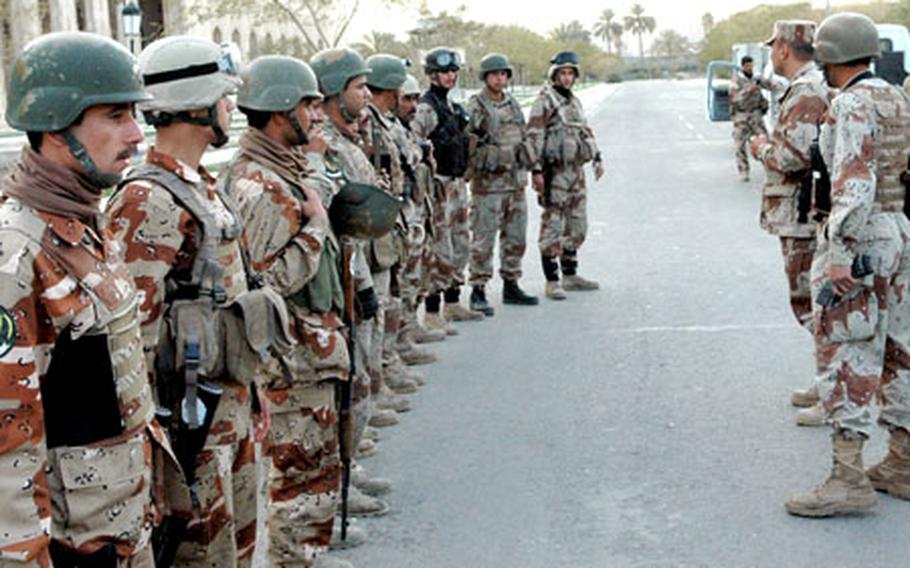 Iraqi army soldiers prepare for a patrol in the neighborhoods surrounding the capital city’s International Zone.