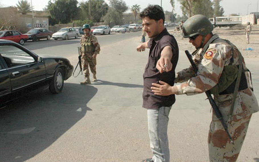 Iraqi soldiers frisk Sahad El Ani, a 30-year-old car salesman, at a temporary checkpoint in Baghdad, one of the few places in Iraq where the army operates with very little oversight from U.S. troops.