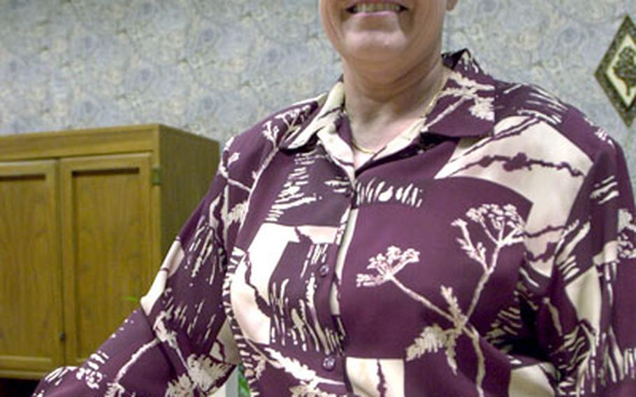 Vickie Briscoe, who started the drama department, stands on the set of her last play at Kadena High School. “See How They Run” was held this weekend and was the same play she began her career with at the high school 25 years ago. She is set to retire at the end of this school year.