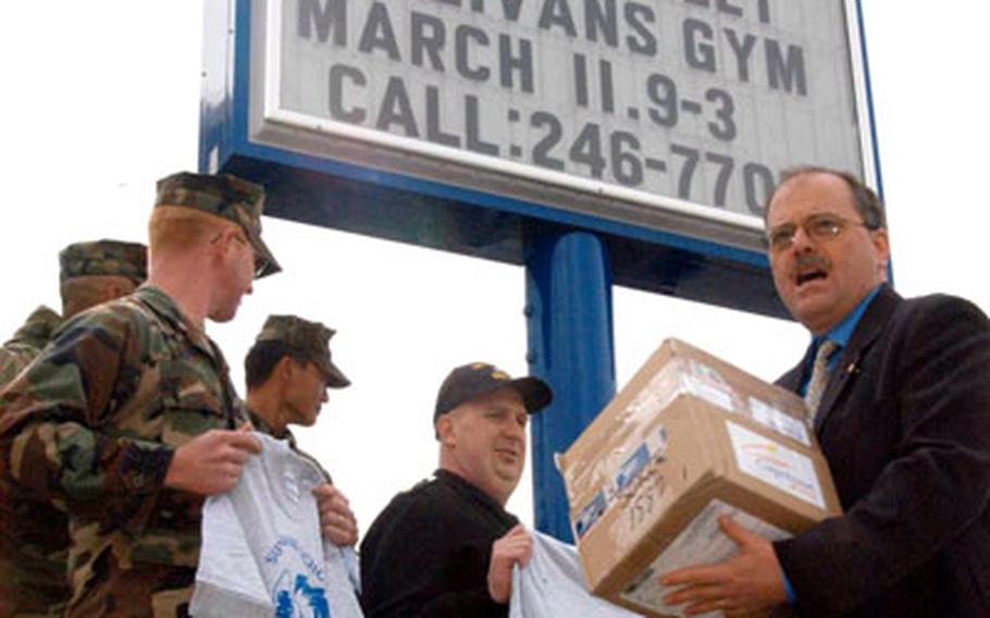 “It takes a community to raise a sign,” The Sullivans Elementary School principal Dave Russell said Monday. The effort to make, deliver and erect the school’s new sign at Yokosuka Naval Base involved a large cast of volunteers and ship- and shore-duty sailors.