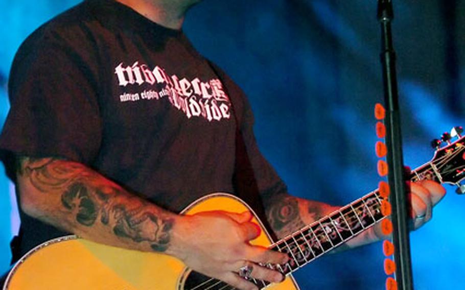 Staind's Aaron Lewis performs for U.S. troops in Baumholder, Germany, Friday night.