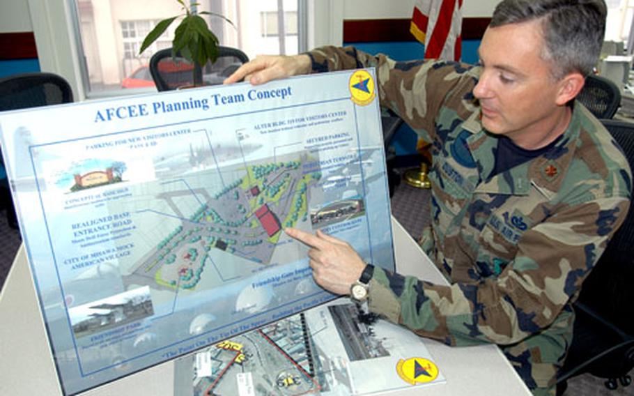 Maj. Mathew Duston, 35th Civil Engineer Squadron Engineering Flight commander, looks at a draft redesign of the area outside Misawa Air Base’s main gate. The base is redesigning the area in part to blend better with a new shopping district the city of Misawa hopes to open in 2008.
