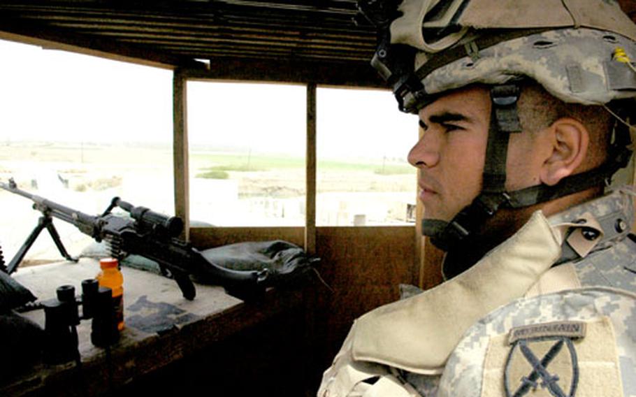 Pfc. David Tablada, 20, from Maryland, stands guard at Patrol Base Courage outside western Baghdad, where troops have seen little sign of sectarian violence, but a shadowy insurgency remains a daily threat.