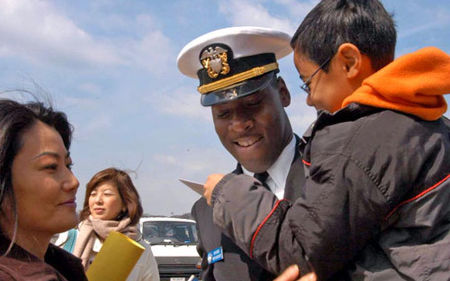 USS Blue Ridge Ship Secretary Tony Berry is greeted with a homemade birthday card from his 7-year-old son, Michael, and by his wife, Hiromi.