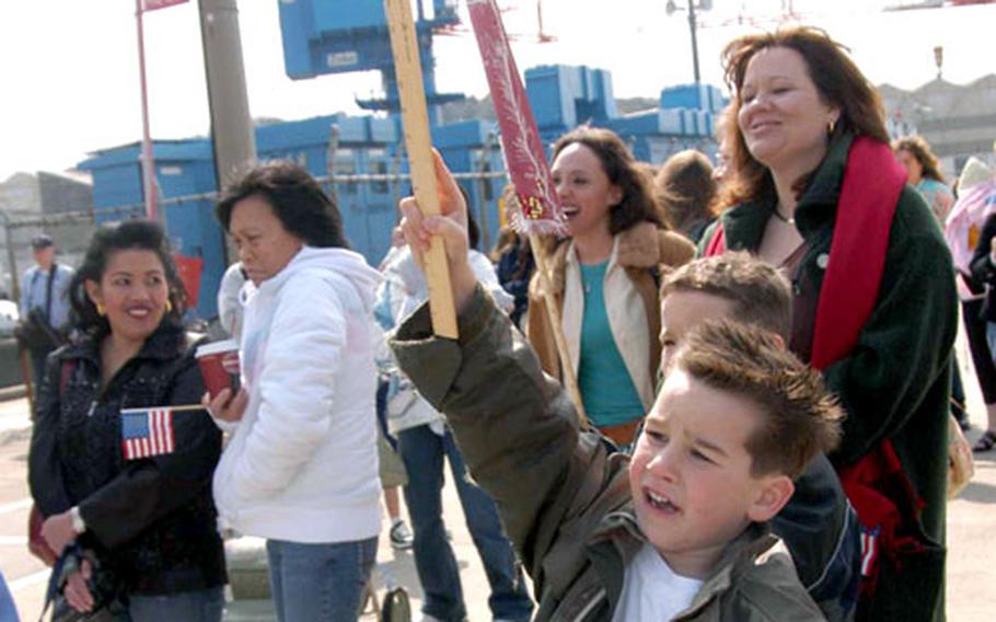 Richard Arnold, 6, waves to his dad aboard the USS Blue Ridge Friday morning at Yokosuka Naval Base.