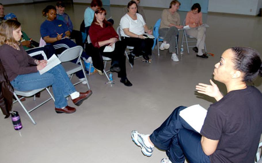 Staff Sgt. Michelle Fox from the Health and Wellness Center at Misawa Air Base, Japan, talks to Sollars Elementary School’s “Biggest Losers, Best Maintainers” support group about nutrition Thursday after school.