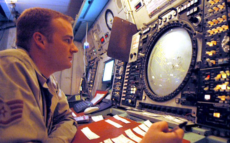 Air Force Staff Sgt. Scott Williams, 27, of Oklahoma City, Okla., monitors air traffic on a radar screen at Ali Base Monday.