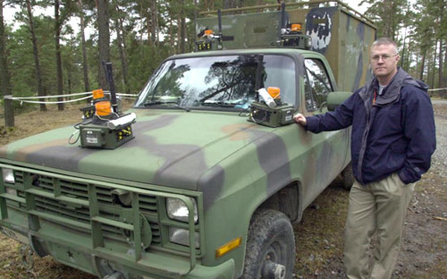 Jim Meredith, section chief of the Training Support Activity Europe’s Deployable Instrumentation Systems Europe, Tuesday with a vehicle covered in sensors that can relay data to satellites and allow trainers to watch the vehicle’s movements in real-time and record them for after-action review.
