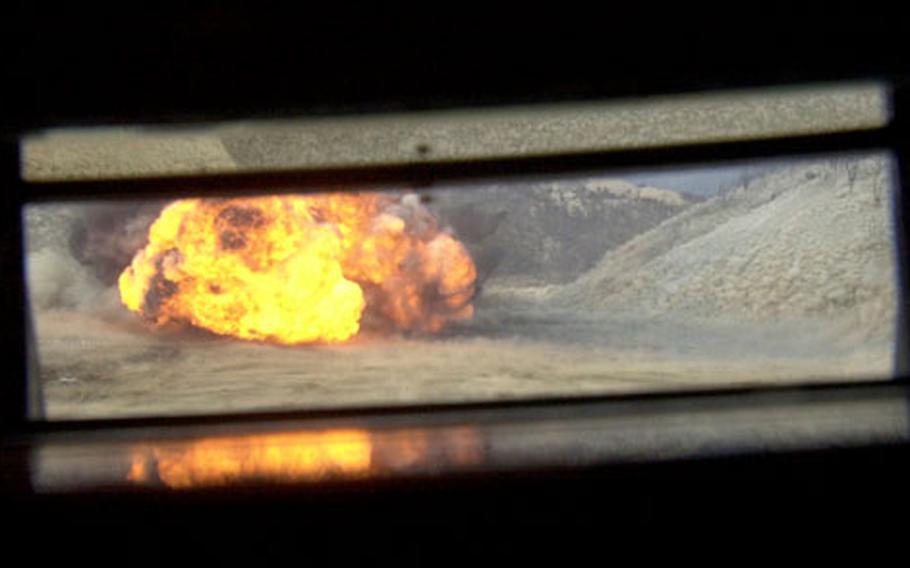The view from inside a South Korean amphibious assault vehicle after a line charge detonation Tuesday at Rodriguez Range. Marine combat engineers use line charges to detonate minefields and clear paths for infantry and armor units.