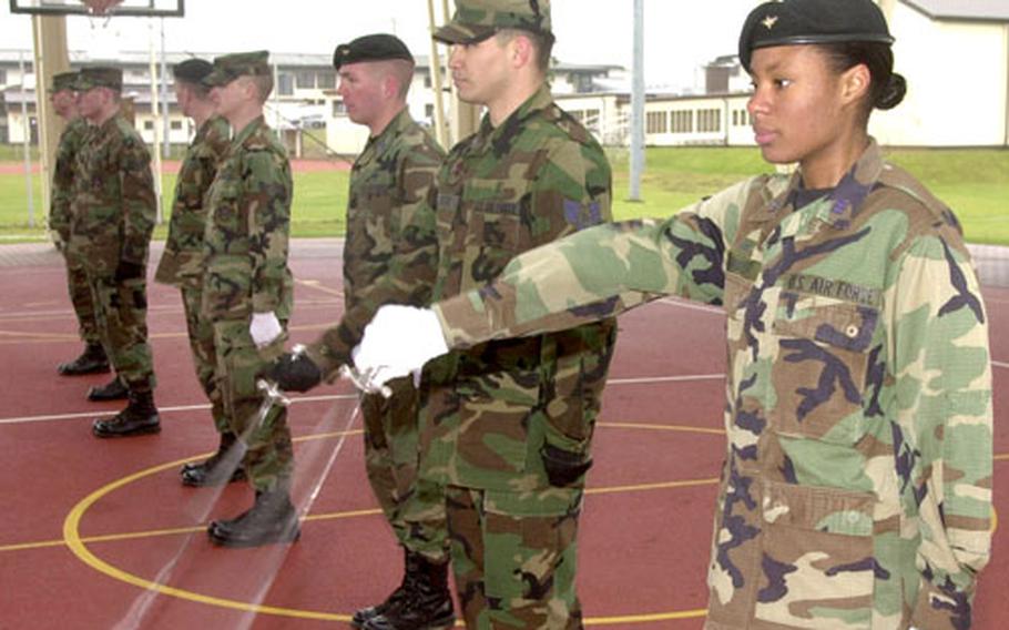 Members of the Spangdahlem Air Base Saber Drill Team practice with cadets from the Air Force Academy on Wednesday in Germany. The Air Force Academy and Spangdahlem Air Base have the Air Force’s only two saber drill teams.