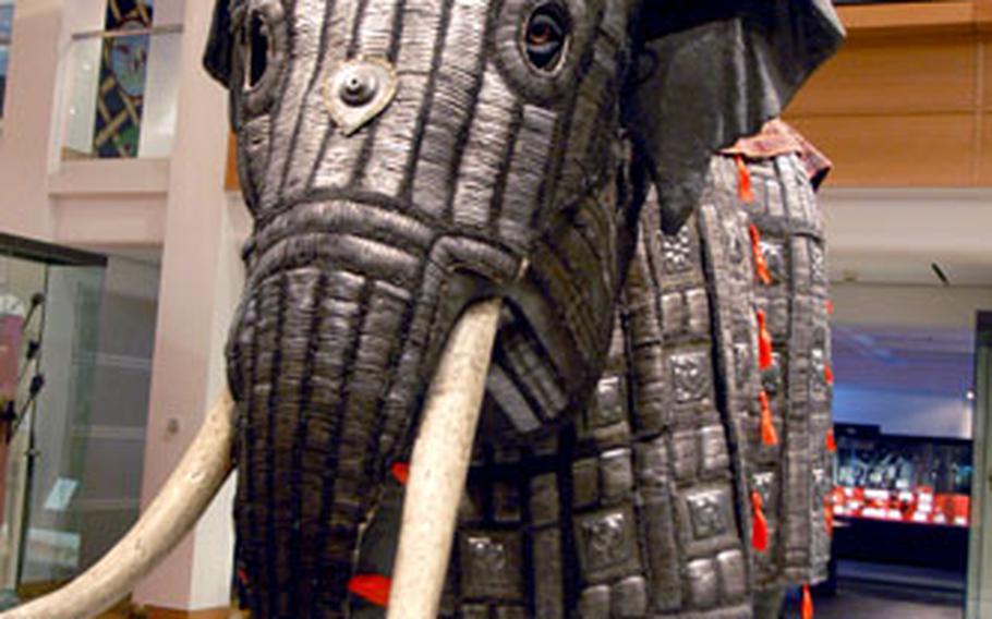 Menacing atop his armored war elephant, a warrior from Central Asia brandishes a spear in the Oriental gallery at the Royal Armouries Museum in Leeds.