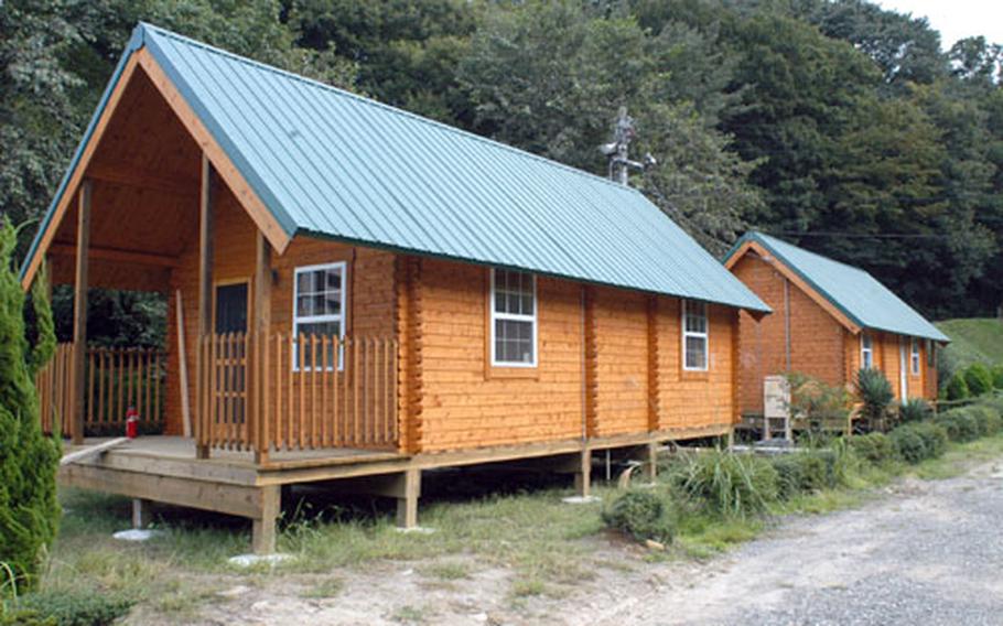 Two of the new standard cabins at the Tama Hills recreation area outside Tokyo.