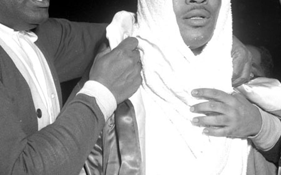 Sugar Ray Robinson with his manager, George Gainsford, after the fight.