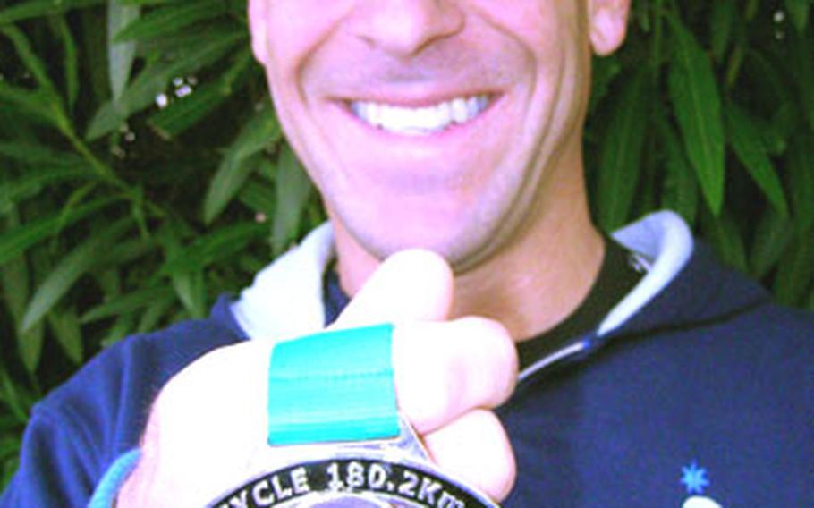 Chief Petty Officer Brian Haug took some time off work at the Explosive Ordnance Disposal detachment at Yokosuka Naval Base to race in the Ironman Australia Triathlon on April 2.