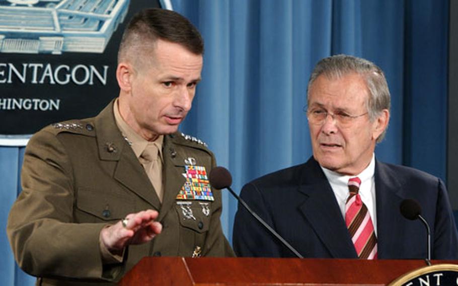 Chairman of the Joint Chiefs of Staff Gen. Peter Pace answers a reporter’s question during a news conference at the Pentagton Tuesday. Defense Secretary Donald Rumsfeld is at right.