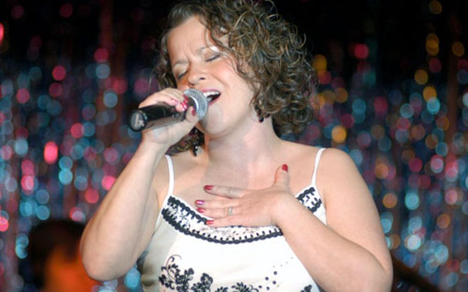Capt. Shelley Frank impresses the judges with a Norah Jones melody at a USAFE Idol event at RAF Alconbury.