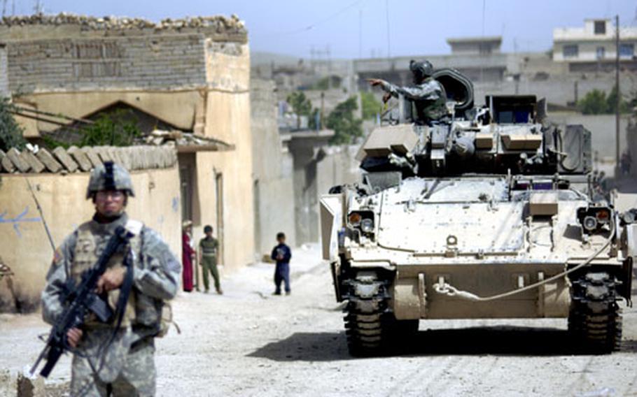 Soldiers from Task Force 2-37, 1st Brigade, 1st Armored Division patrol Tal Afar, Iraq, as part of Operation Duke Storm.