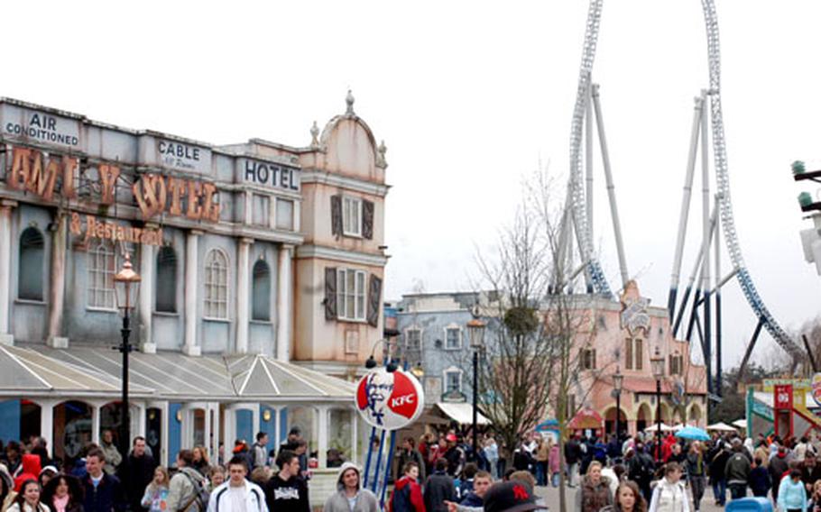 Throngs of amusement-seekers crowd the faux-seaside streets of Amity, Thorpe Park's fantasy playland, while riders on the new Stealth get ready for a rapid descent in the background.