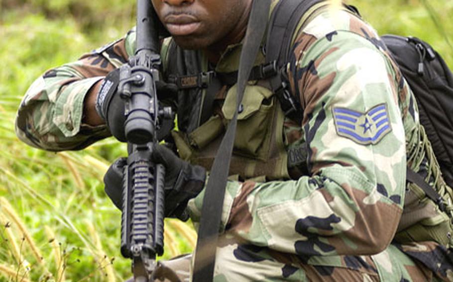 Staff Sgt. Deroni Brown performs tracking recently for a tactical tracking class. As part of the 736th Security Forces at Andersen Air Force Base, Brown undergoes plenty of training — some of which may have helped him save a man’s life Tuesday after an apparent heart attack.