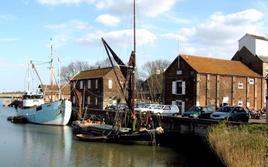 A handful of boats moor on the banks of the River Alde. Visitors to Snape Maltings can take boat rides up the river to birdwatch or simply take in the natural beauty.