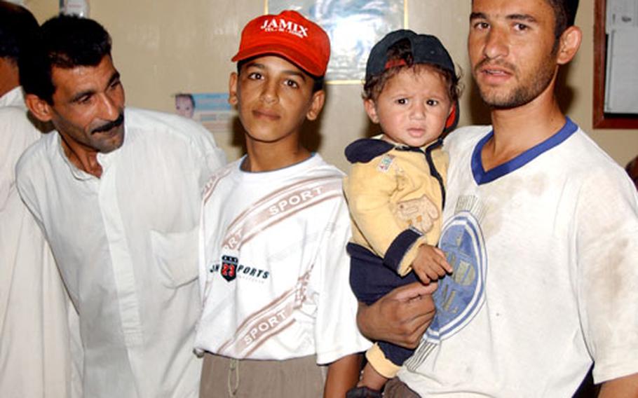 Iraqis line up outside the clinic in Mukhisa to receive medical attention as part of a U.S. mission to establish an Iraqi army presence in the town. The clinic is part of an operation led by the 1st Battalion, 68th Armor Regiment to create good will in this Sunni town about 20 miles northeast of Baqouba.