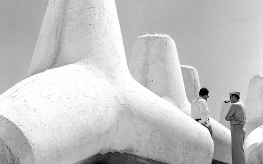 Concrete tetrapods, each weighing between eight and 25 tons, on the beach at Rota.