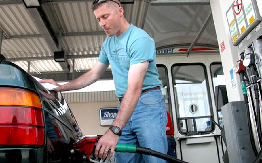 Lt. Col. Steve Miska, of the 2nd Brigade, 1st Infantry Division, fills up his tank at the gas station on Leighton Barracks in Würzburg, Germany. AAFES pump prices typically reflect stateside prices, which jumped more than 41 cents a gallon in the past four weeks, but AAFES customers will catch a break next month after officials capped the increase at 25 cents a gallon.