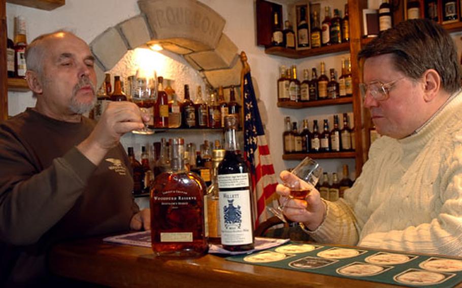 Heinz Taubenheim, left, and Gilbert Adams, a retired U.S. Army officer, enjoy a taste of one of Taubenheim’s finest bourbons in January.