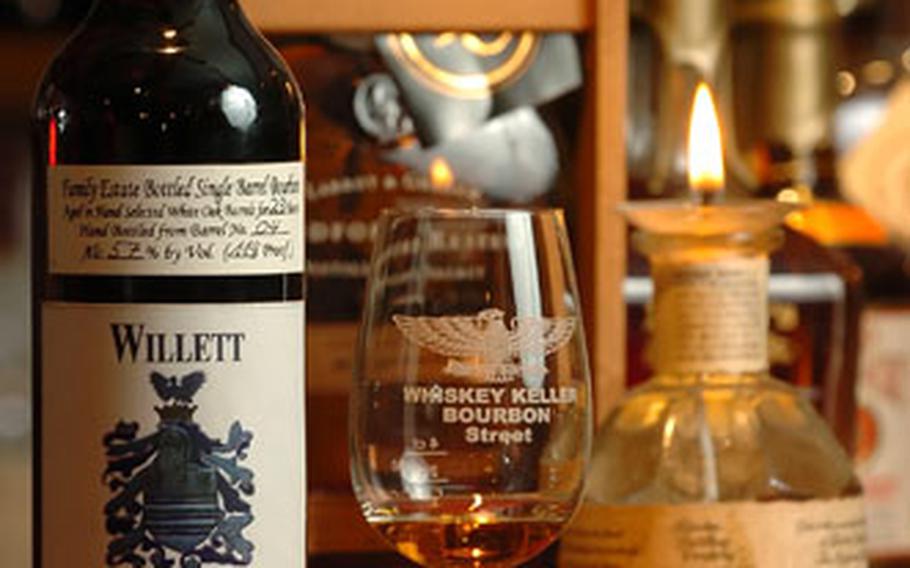A bottle of 23-year-old Willet Straight Kentucky bourbon whiskey sits on display at Taubenheim’s whiskey cellar.