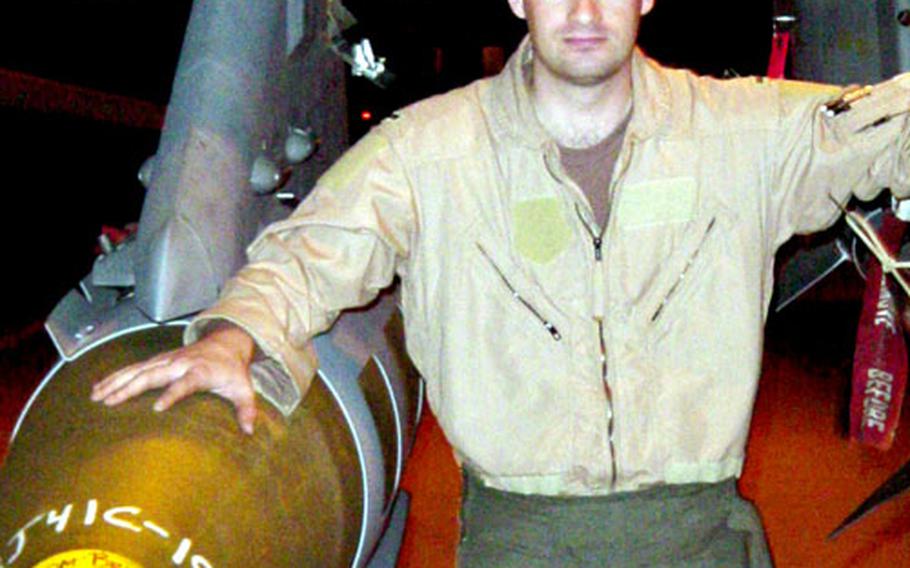 Then-1st Lt. Steve “Bjorn” Engberg stands next to an F-16 “Fighting Falcon” before flying a combat sortie, while deployed to Al Jaber Air Base, Iraq.