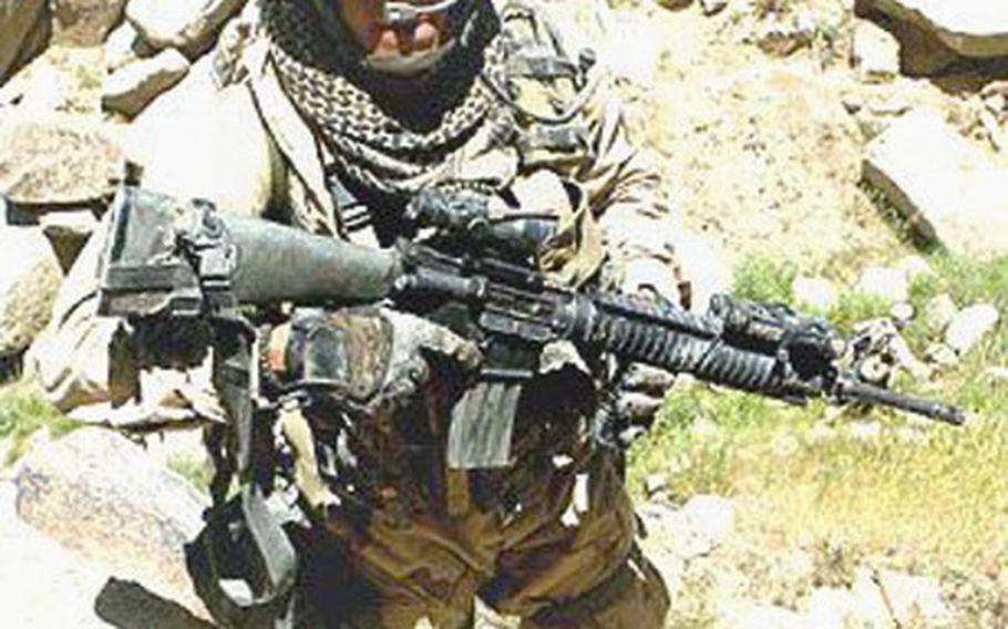 Despite a bullet in the leg, Marine Staff Sgt. Anthony Viggiani continued to lead his squad against the enemy in Afghanistan in 2004.