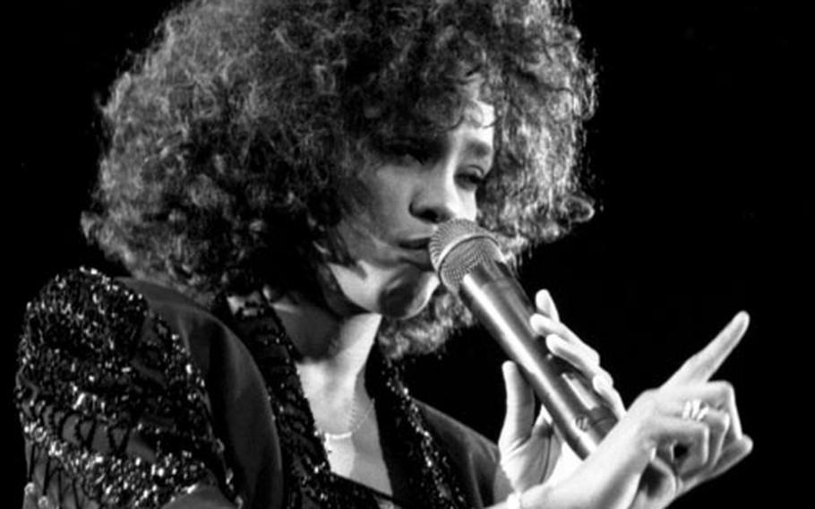 Whitney Houston performs at the Festhalle in Frankfurt, West Germany, in May, 1988.
