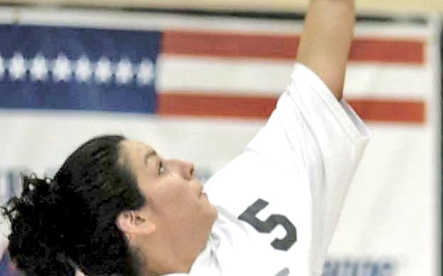 Mildenhall Marauders player Patricia Armstrong launches a serve against the Ramstein Rams on Friday at the Alconbury Fitness Center during the finals of the U.S. Air Forces in Europe volleyball championships.