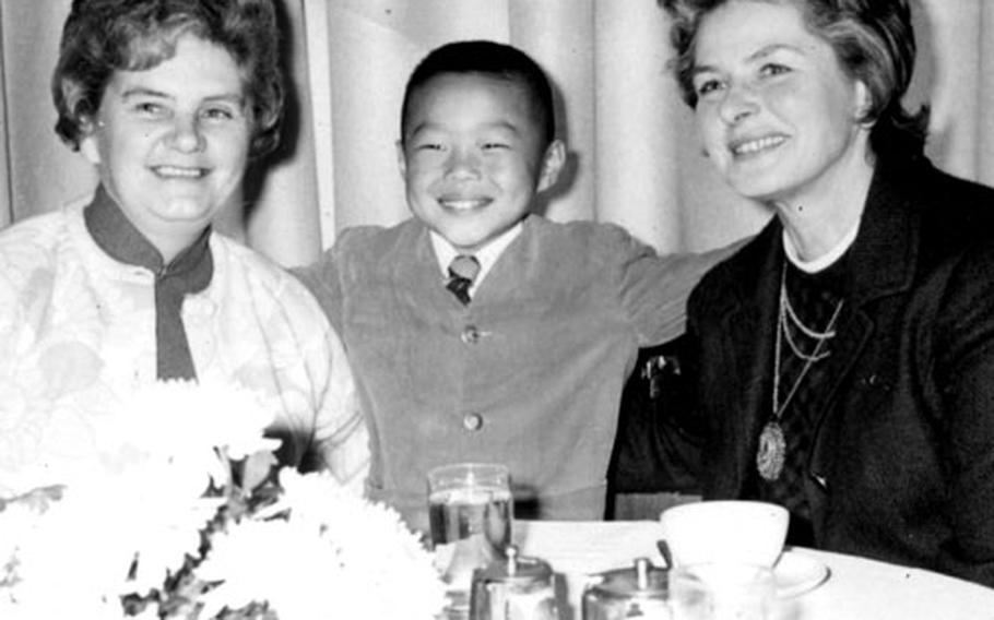 Ingrid Bergman, right, chats with Kathleen Langton-Smith, superintendent of the Gladys Aylward Children's Home, and six-year-old Gordon Aylward, adopted son of the late Miss Aylward.