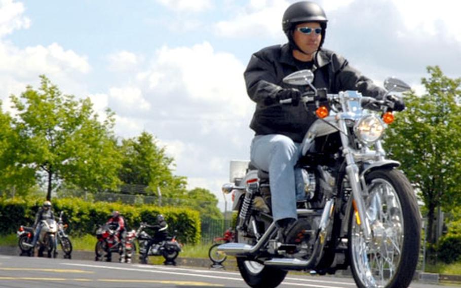 Sgt. 1st Class Kevin Jackson, tank platoon sergeant, 1st Battalion, 77th Armor Regiment, brings his Harley to a 30-mph emergency stop during a cycle safety event Wednesday on Conn Barracks.