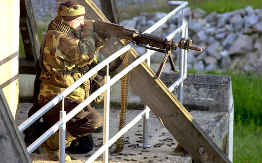 A soldier from 1st Battalion, 4th Infantry Regiment defends Ubensdorf after it came under attack by Troop B, 1st Squadron, 1st Cavalry Regiment during exercises on Thursday.