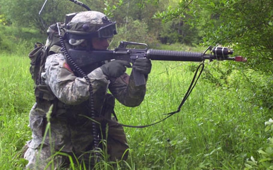A soldier from Troop B, 1st Squadron, 1st Cavalry Regiment advances on Ubensdorf during the Iron Storm exercise on Thursday. The unit will be getting Shadow UAVs as part of transformation that began with the departure of the Kiowa helicopters.